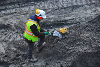 Image of a man in hard hat and construction vest