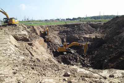 Image of heavy equipment digging out a contaminated site