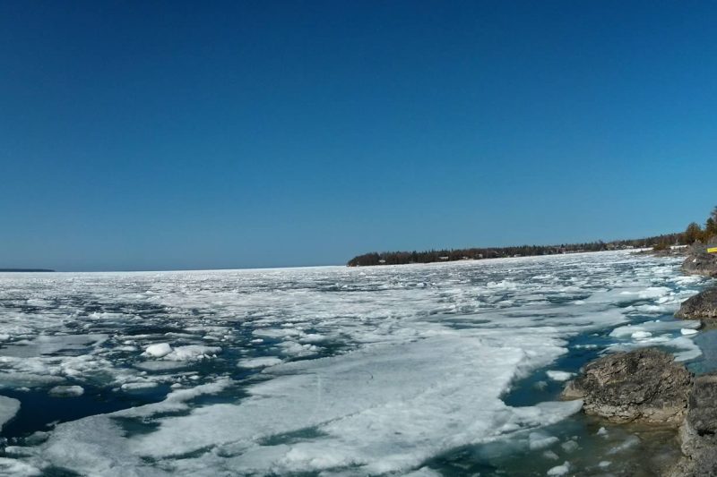 Image of a half frozen lake in winter