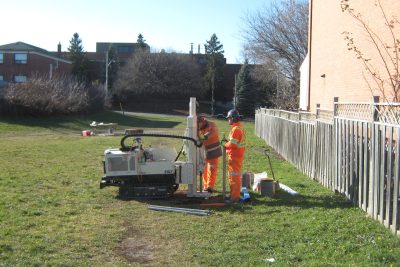 Image of employees conducting monitoring in suburban neighbourhood