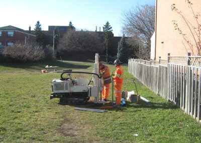 Image of employees conducting monitoring in suburban neighbourhood