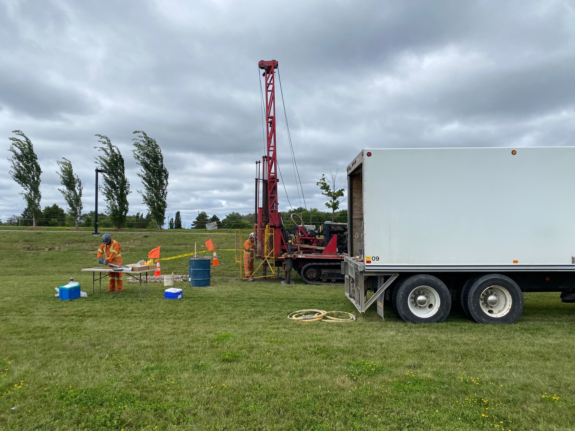 Image of Environmental Assessment team working onsite with equipment and a truck.