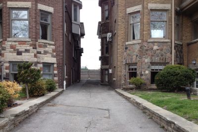 Image of alleyway between two old houses, as part of a pre-construction condition assessment.