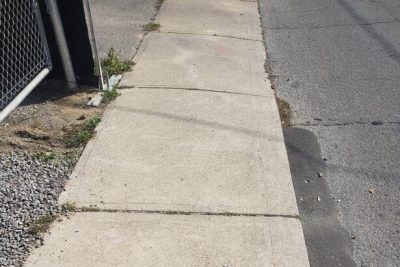 Image of a concrete sidewalk that may require repair.