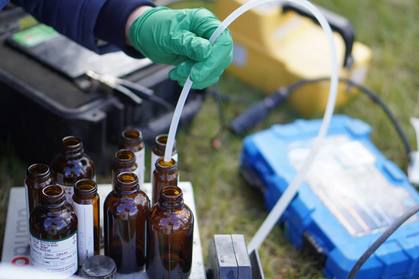 Landing page banner image. Staff filling up bottles.
